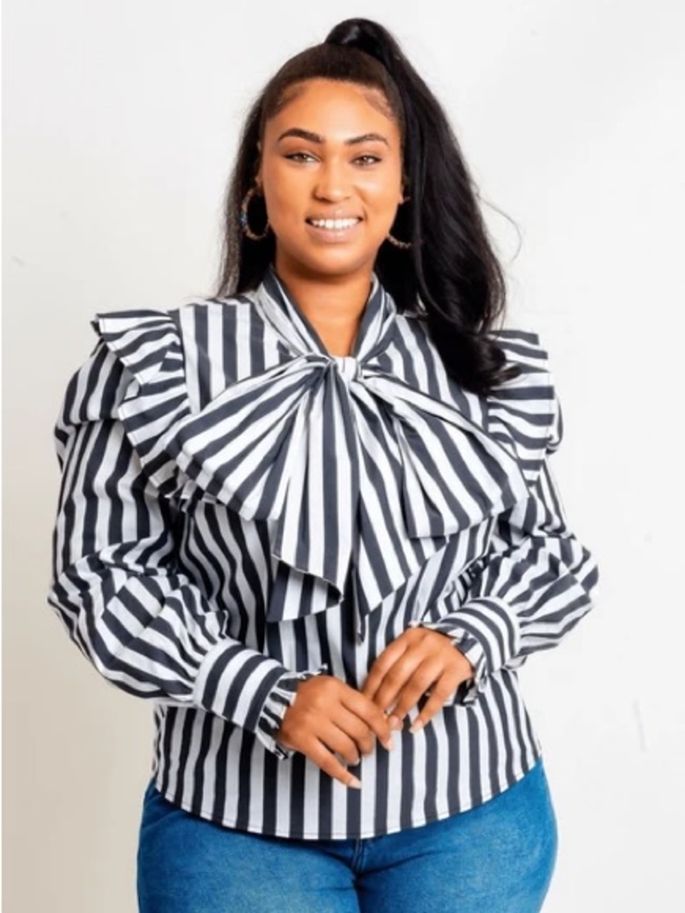 Ashley Stewart top features navy and white vertical stripes Size 24